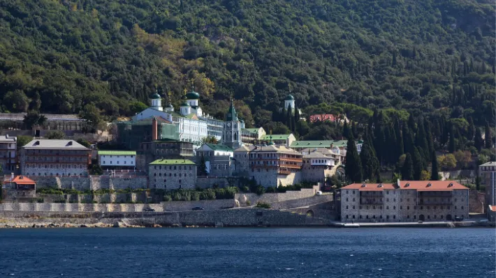 Cliffside monastery on Mount Athos, Greece, the autonomous monastic community that still governs daily life by the Julian calendar