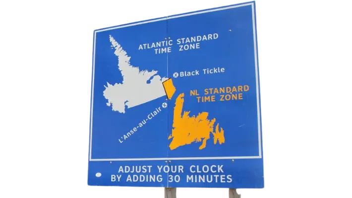 Road sign in Labrador marking the boundary between Atlantic Standard Time and Newfoundland Standard Time near Black Tickle, instructing drivers to adjust their clocks by 30 minutes
