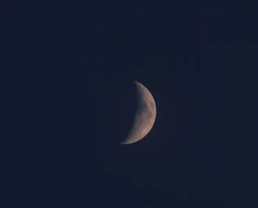 waxing crescent moon in the night sky showing lunar phase