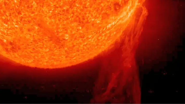 Close-up of a solar flare and plasma eruption on the Sun's surface, the kind of coronal mass ejection that triggers geomagnetic storms and auroras on Earth