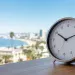 Analog clock with a Pacific Coast view representing Pacific Time