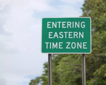 Road sign showing entering Eastern Time Zone