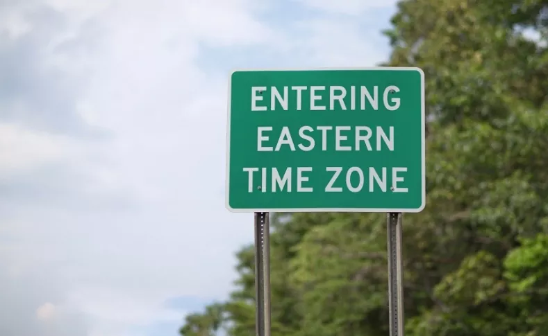 Road sign showing entering Eastern Time Zone