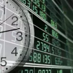 Stock market opening times worldwide with clock and financial data screen